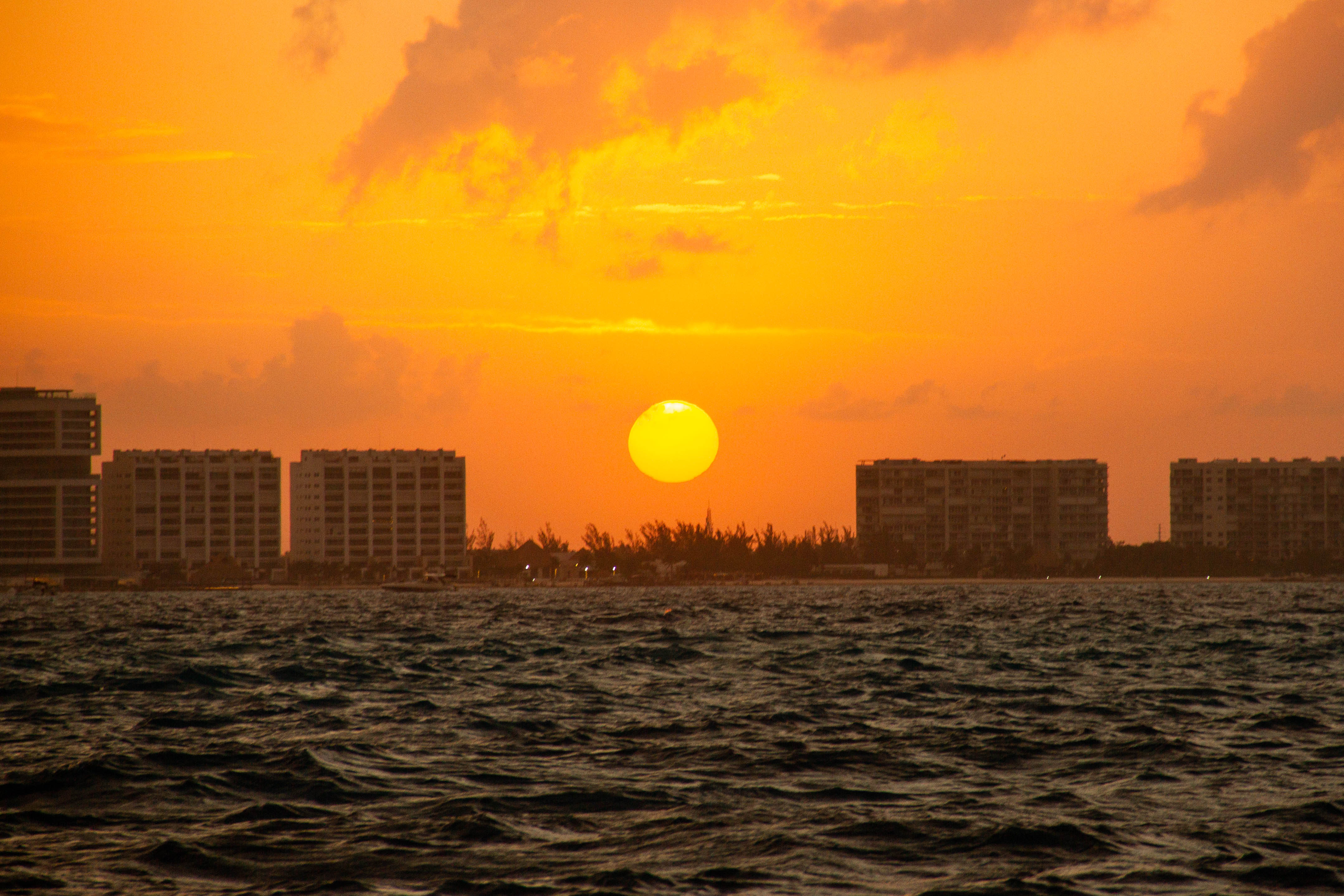 cancun sunset from the sea